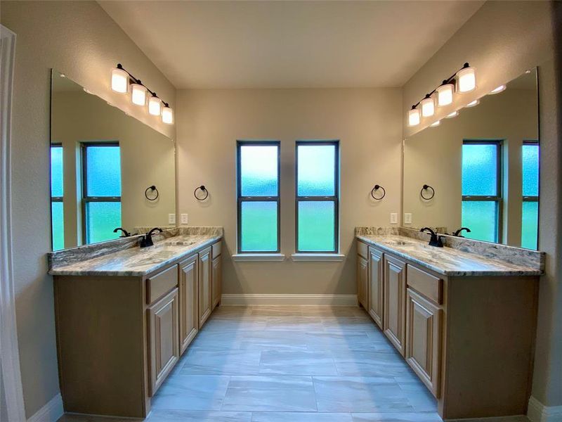 Master bath offers his & hers vanities