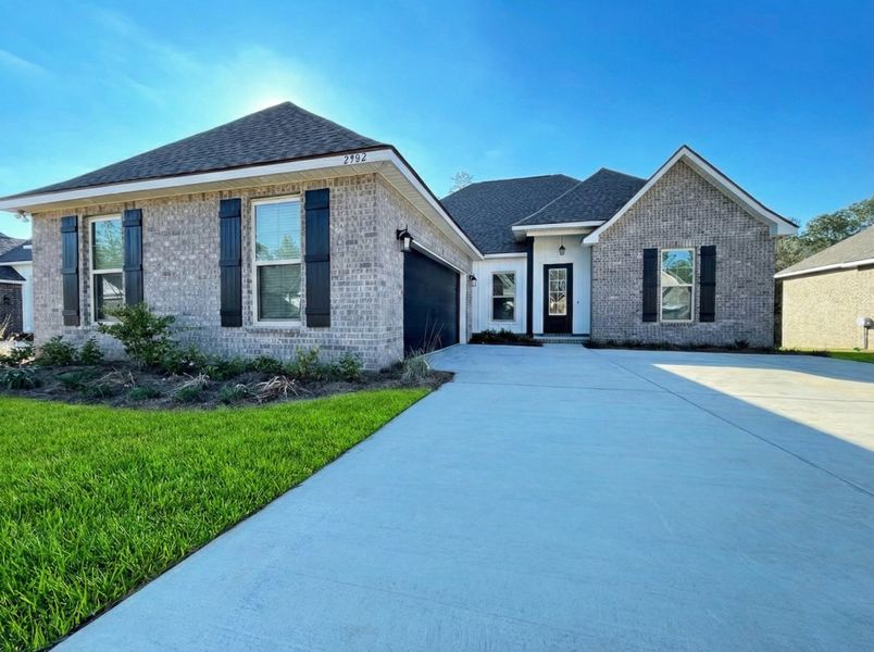 Front exterior of a new home in Iron Rock, Cantonment, FL, highlighting curb appeal (Image 1). Front exterior of a new home in Iron Rock, Cantonment, FL, highlighting curb appeal (Image 1).