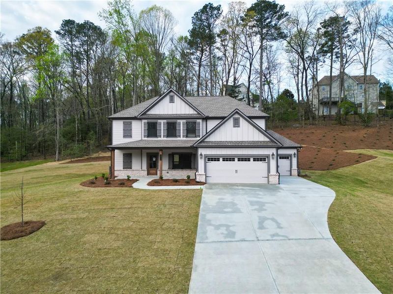 Front exterior of a new home in Red Oak Ridge, Loganville, GA, highlighting curb appeal (Image 18).