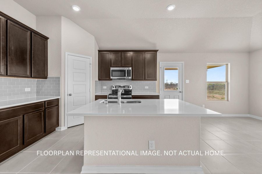 Modern kitchen with sleek countertops and ample cabinet space for culinary endeavors.