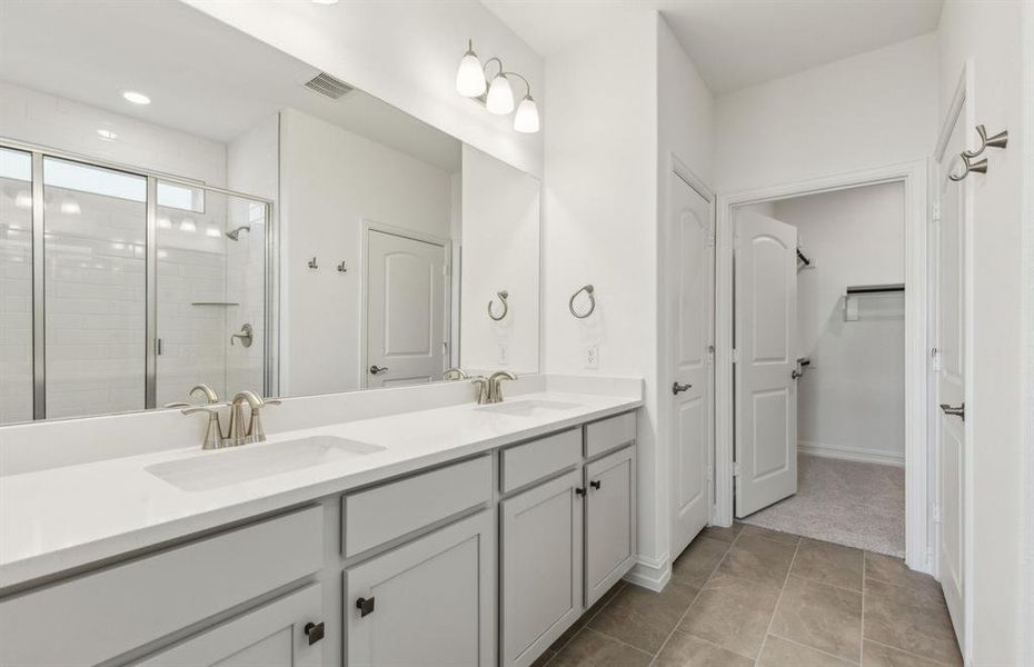 Elegant owner's bathroom with dual vanity *real home pictured Elegant owner's bathroom with dual vanity *real home pictured