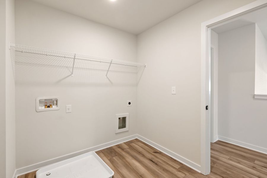 A room with a wood floor and white walls. A room with a wood floor and white walls.