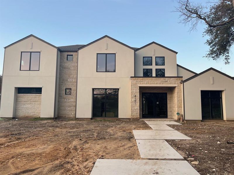 View of front of home featuring a garage