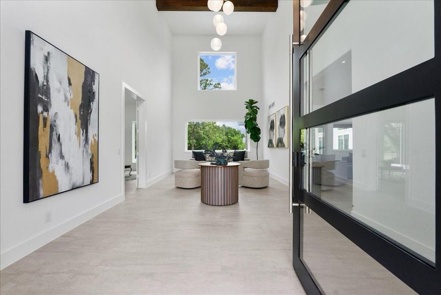 Make a statement from the moment you walk in with this grand foyer with 25ft vaulted ceilings.