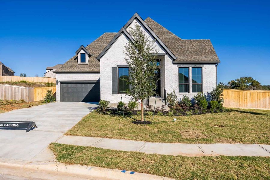 Front exterior of a new home in Nolina 60', Georgetown, TX, highlighting curb appeal (Image 2). Front exterior of a new home in Nolina 60', Georgetown, TX, highlighting curb appeal (Image 2).