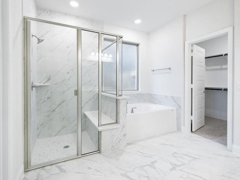 Bathroom featuring separate shower and tub