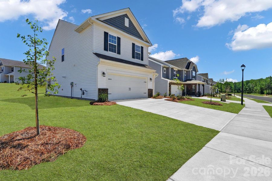 Front exterior of a new home in Shannon Woods, Maiden, NC, highlighting curb appeal (Image 17). Front exterior of a new home in Shannon Woods, Maiden, NC, highlighting curb appeal (Image 17).