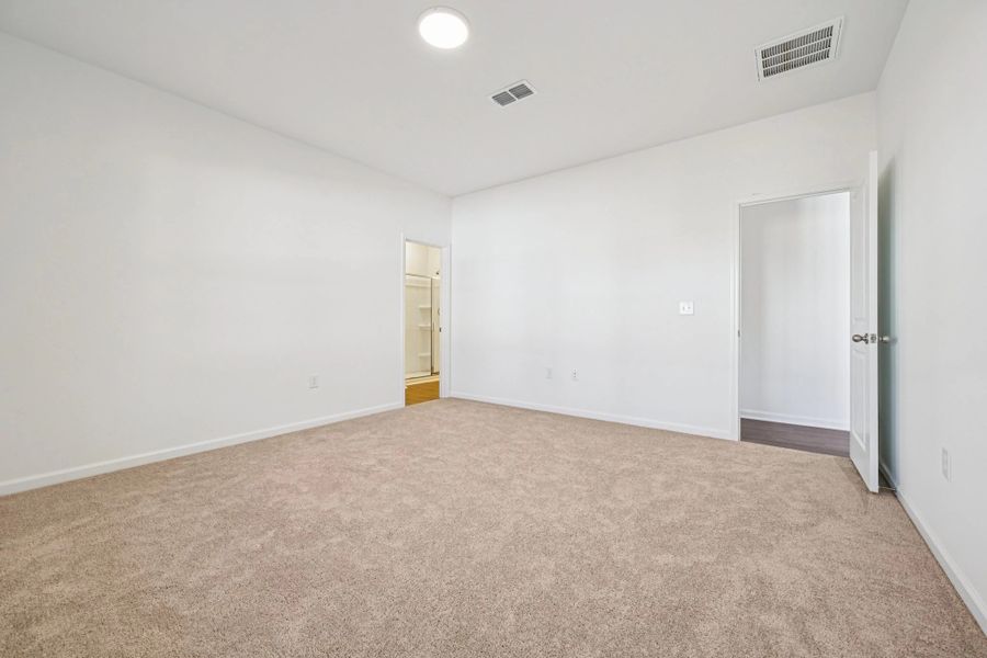 Primary Bed - A sophisticated retreat with style.