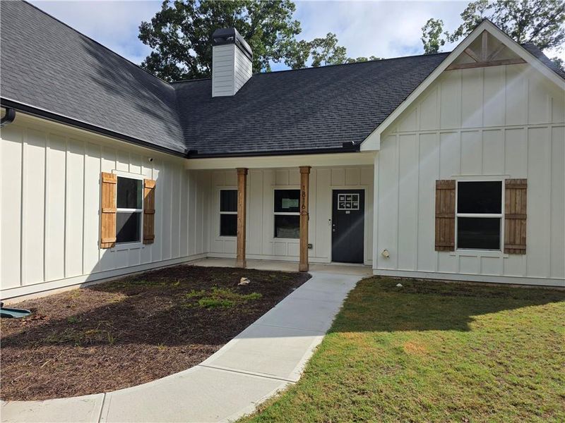 Front exterior of a new home in , Statham, GA, highlighting curb appeal (Image 13).