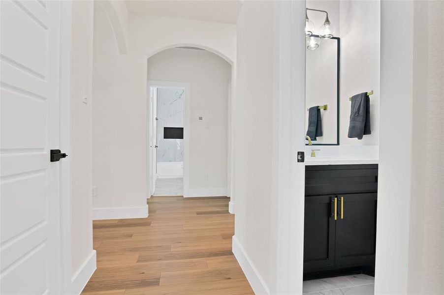 Corridor with light hardwood / wood-style floors