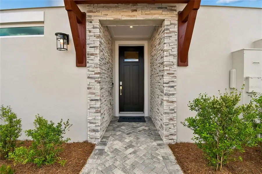 Exterior details and patio area of a home in EvenTide, New Smyrna Beach (Image 3).