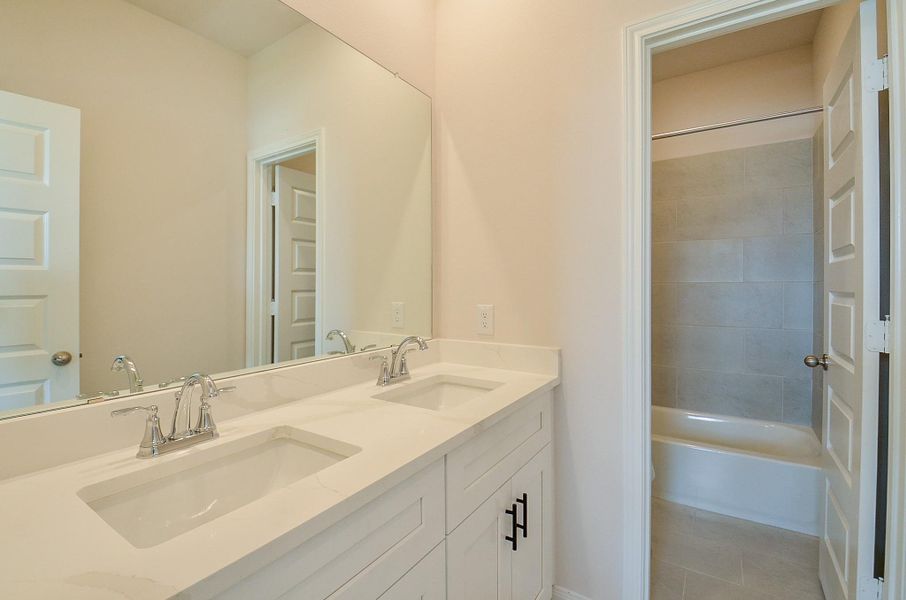 Step into this bathroom, that also has double sinks. Step into this bathroom, that also has double sinks.