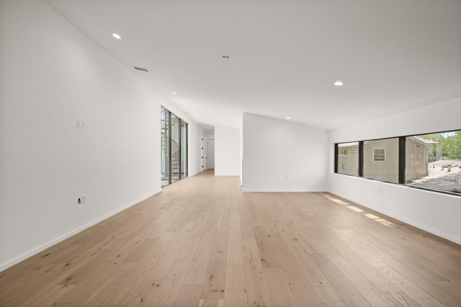 Empty room with recessed lighting and light wood-type flooring