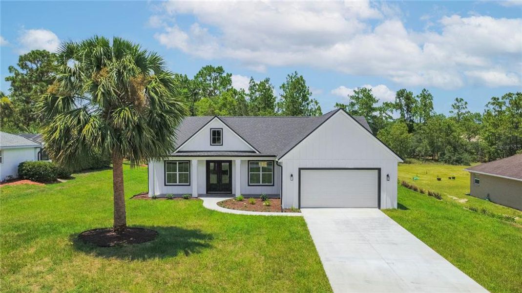 Front exterior of a new home in , Inverness, FL, highlighting curb appeal (Image 29).