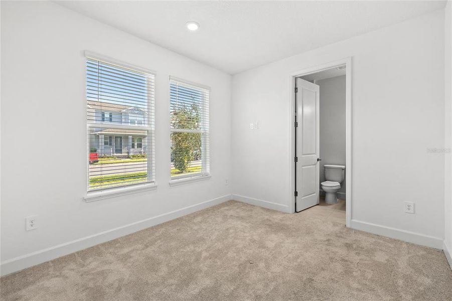Spacious, unfurnished interior of a new home in Harvest At Ovation 50s, Winter Garden (Image 21).