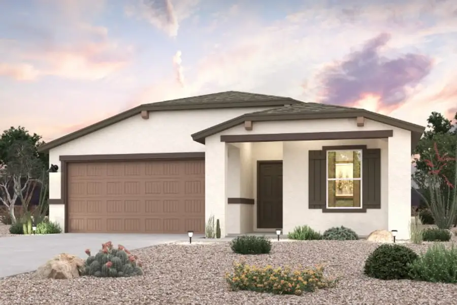 A house with a garage and bushes.