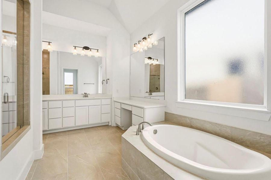 Primary Bathroom with lots of space to relax or get ready for the day!