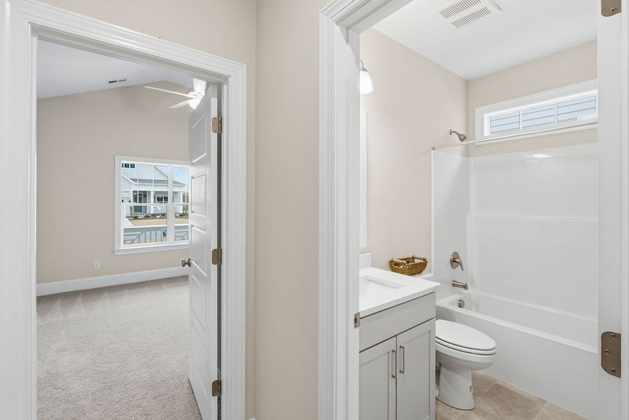 Representative furnished interior of a home built from the Kauai by Bill Clark Homes in The Sanctuary at Sunset Beach, Sunset Beach (Image 18).