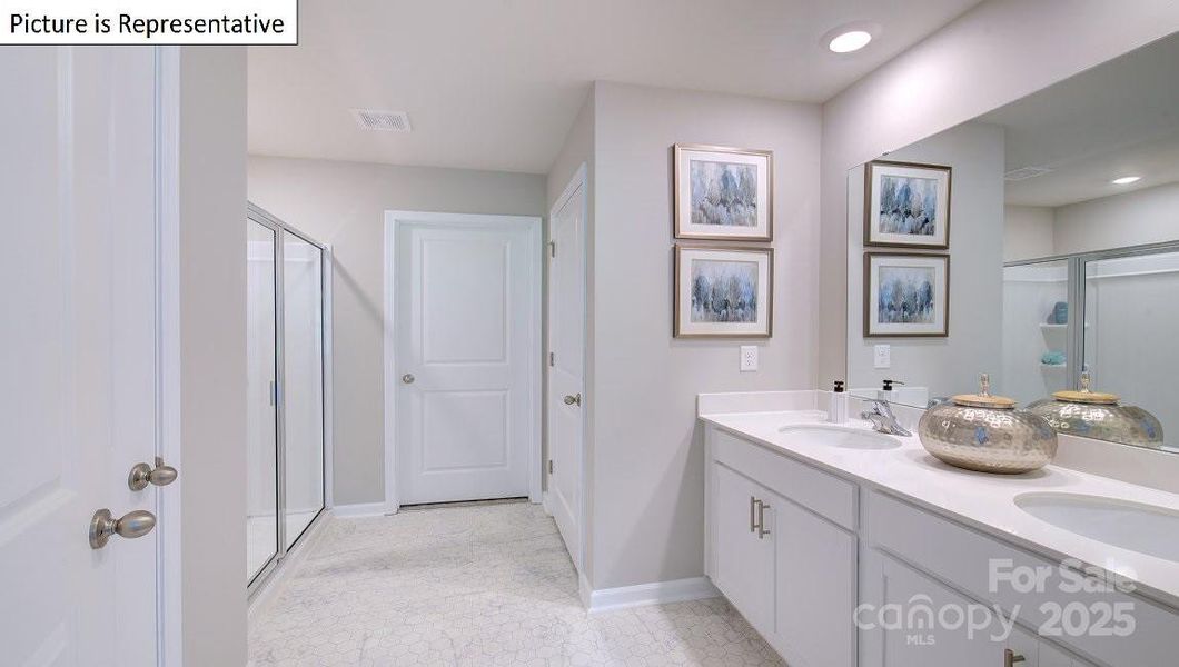 Primary bathroom with dual sinks and 5ft shower