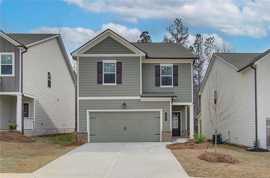 Front exterior of a new home in Crofton Place Enclave, Snellville, GA, highlighting curb appeal (Image 20). Front exterior of a new home in Crofton Place Enclave, Snellville, GA, highlighting curb appeal (Image 20).