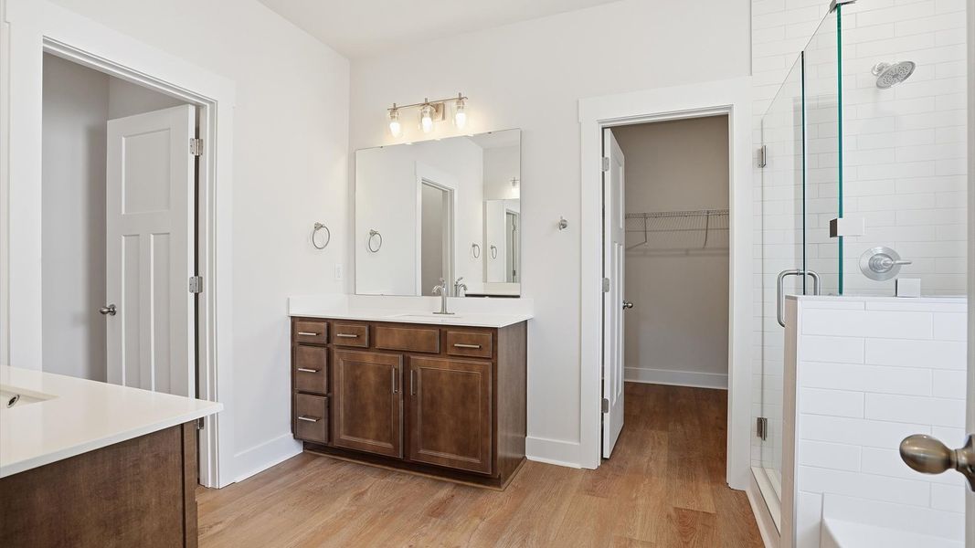 Primary bathroom designed for everyday comfort with elegant finishes throughout by DRB Homes Primary bathroom designed for everyday comfort with elegant finishes throughout by DRB Homes