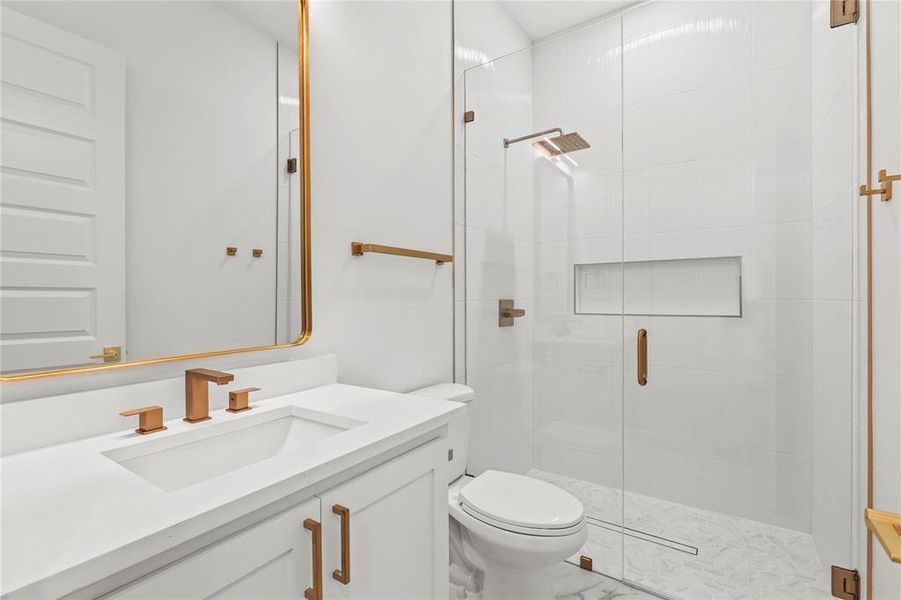 Full bathroom featuring a shower stall and vanity