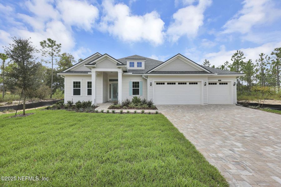 Front exterior of a new home in Hidden Creek at SilverLeaf, St. Augustine, FL, highlighting curb appeal (Image 18).