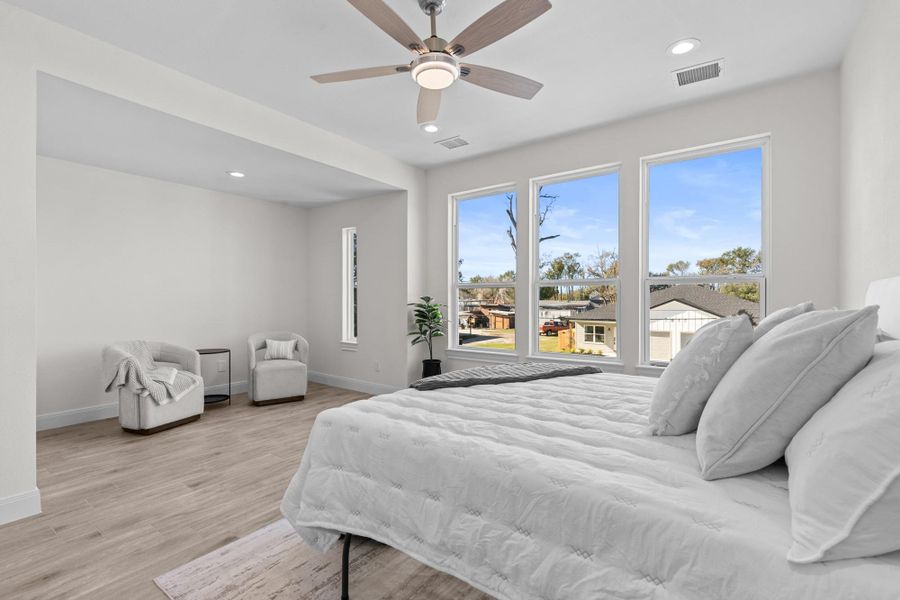 Large primary bedroom with sitting area