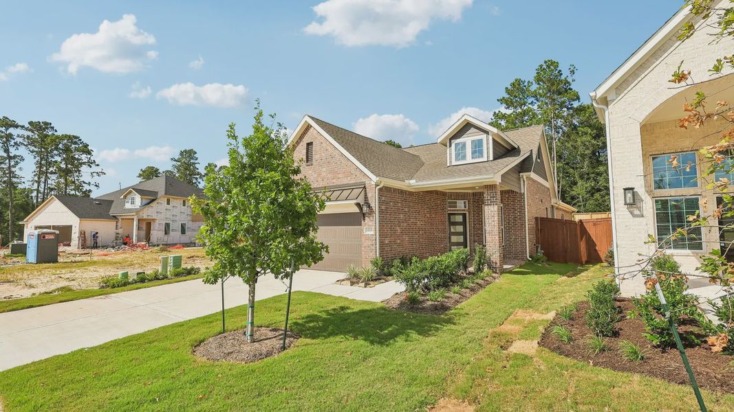 Front exterior of a new home in Evergreen 40s, Conroe, TX, highlighting curb appeal (Image 16).