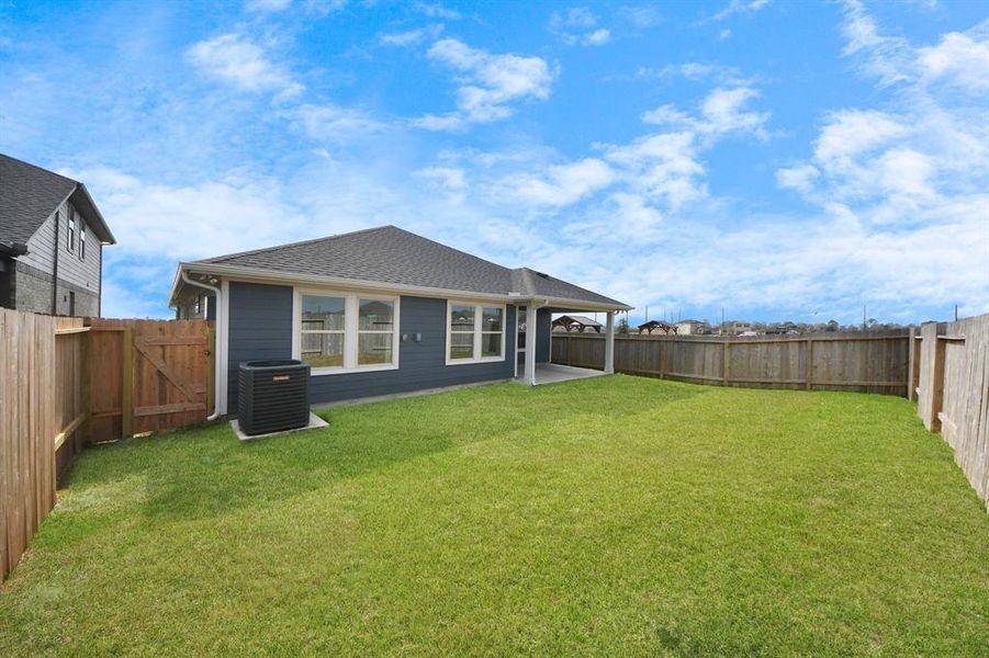 Exterior details and patio area of a home in Sweetgrass Village, Crosby (Image 4).