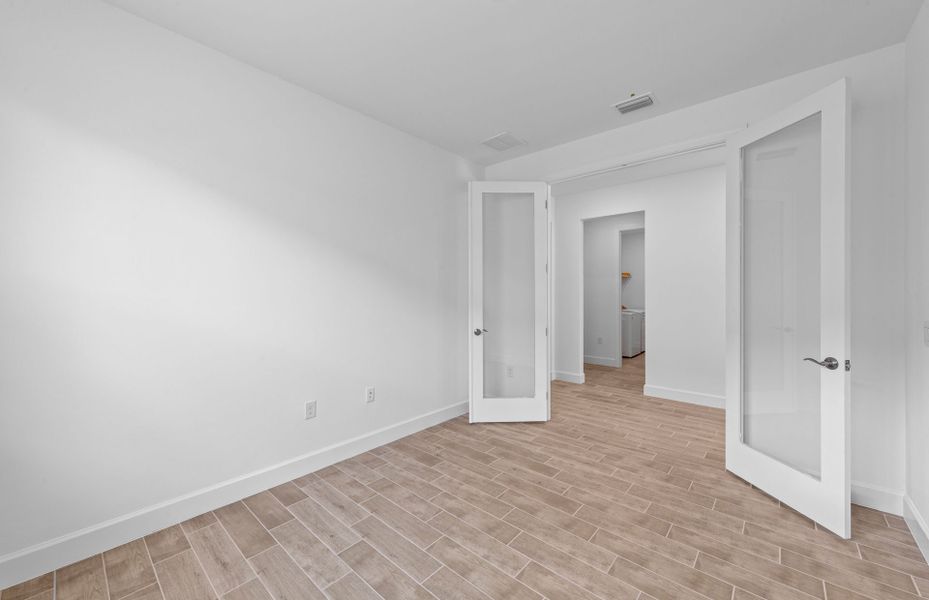 Enclosed flex room featuring elegant French doors