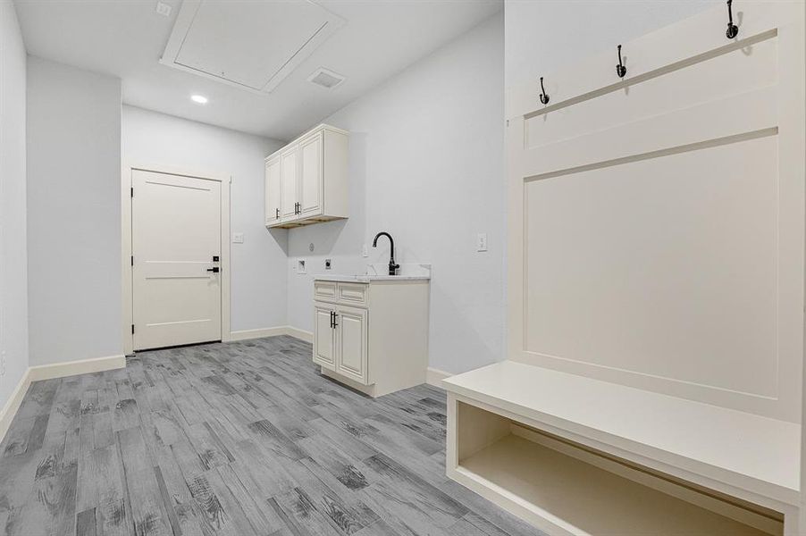 LARGE laundry room with sink and built in hall tree