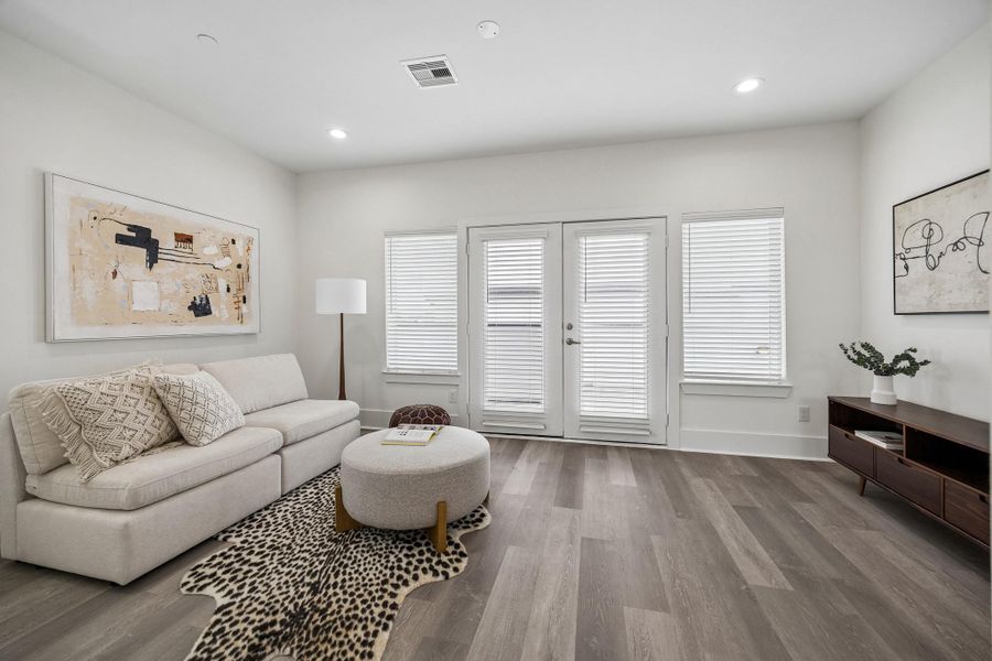 The family room on the fourth floor is a great place to relax. The French doors open onto the the expansive rooftop terrace. The family room on the fourth floor is a great place to relax. The French doors open onto the the expansive rooftop terrace.