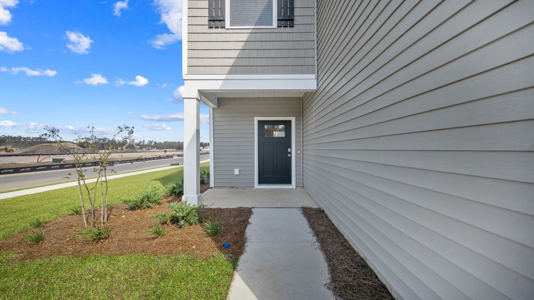 Front exterior of a new home in The Retreat at East Argent, Ridgeland, SC, highlighting curb appeal (Image 2).