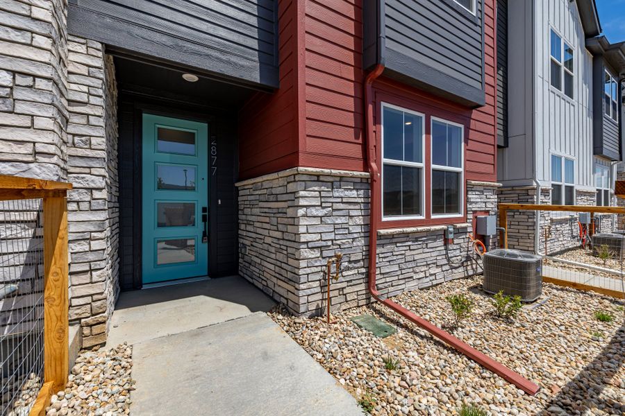 Front exterior of a new home in Arras Park, Thornton, CO, highlighting curb appeal (Image 2).