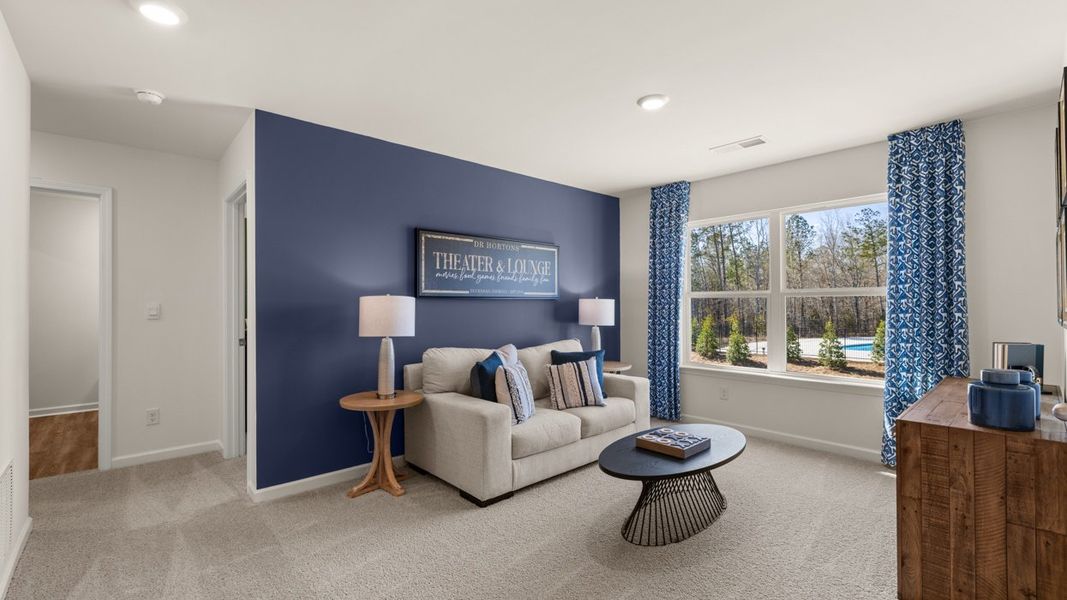 Representative furnished interior of a home built from the Hayden by D.R. Horton in Champion's Run, Lithonia (Image 9).