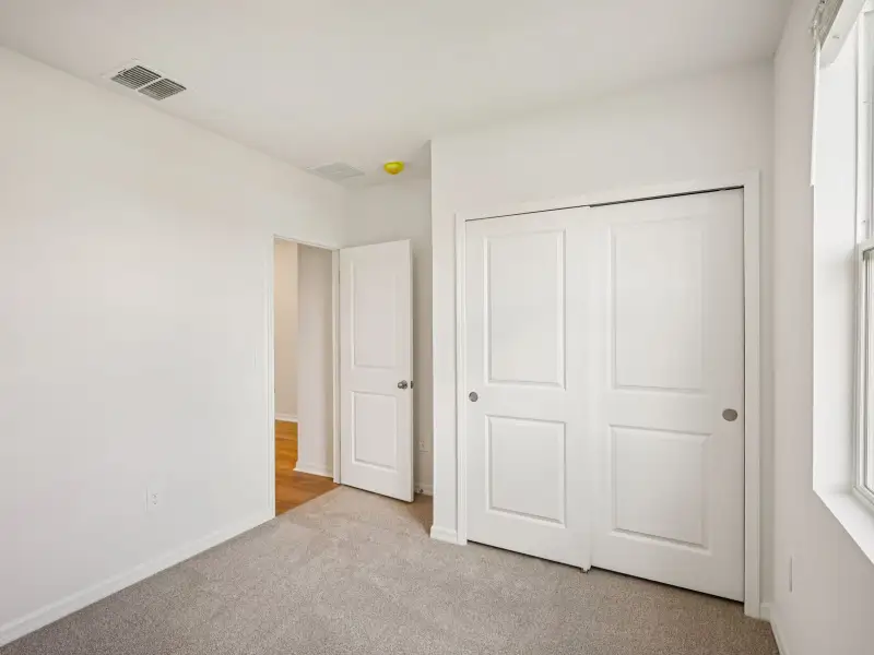 Spacious, unfurnished interior of a new home in The Grove at Stuart Crossing - Classic Series, Bartow (Image 17). Spacious, unfurnished interior of a new home in The Grove at Stuart Crossing - Classic Series, Bartow (Image 17).