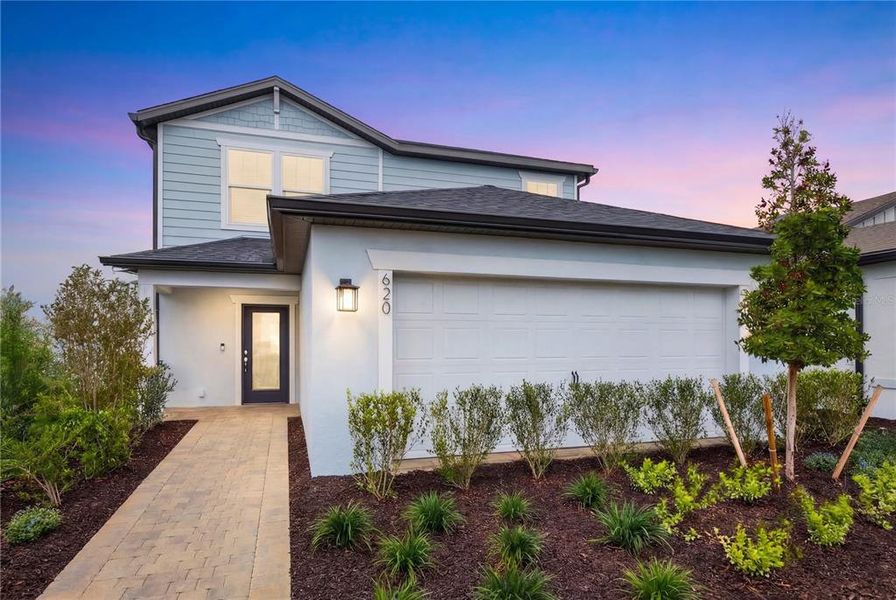 Front exterior of a new home in Reagan Landing, Bradenton, FL, highlighting curb appeal (Image 1). Front exterior of a new home in Reagan Landing, Bradenton, FL, highlighting curb appeal (Image 1).