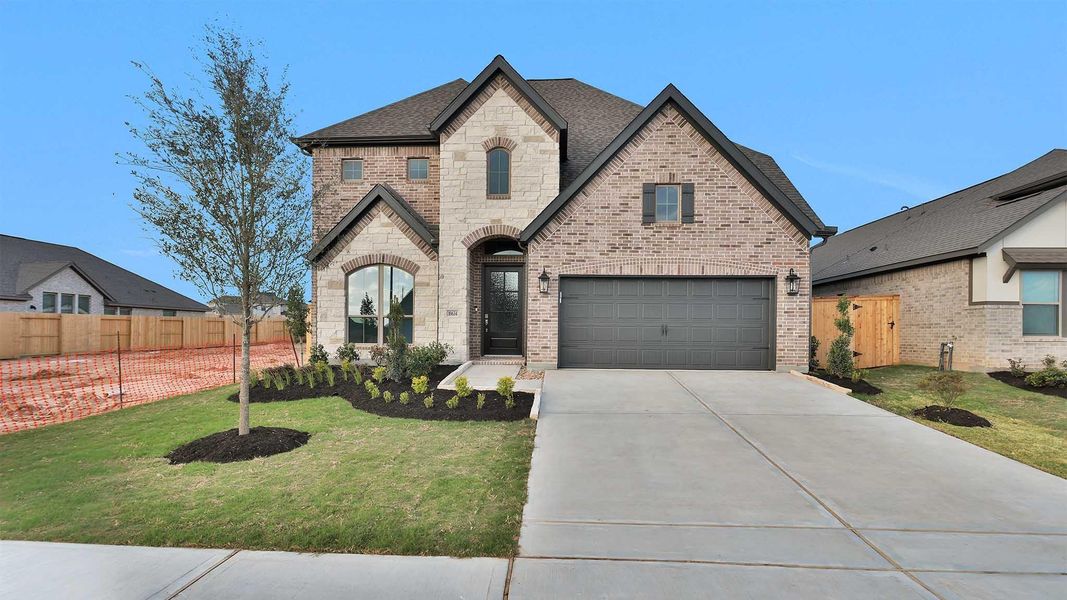 Front exterior of a new home in Candela, Richmond, TX, highlighting curb appeal (Image 2).