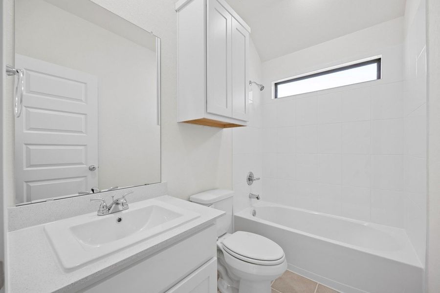 Bathroom in the Cypress home plan by Trophy Signature Homes - REPRESENTATIVE PHOTO