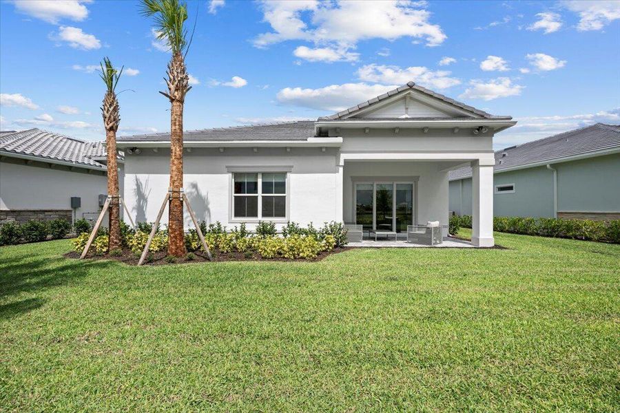 Front exterior of a new home in Avondale at Avenir, Palm Beach Gardens, FL, highlighting curb appeal (Image 2).