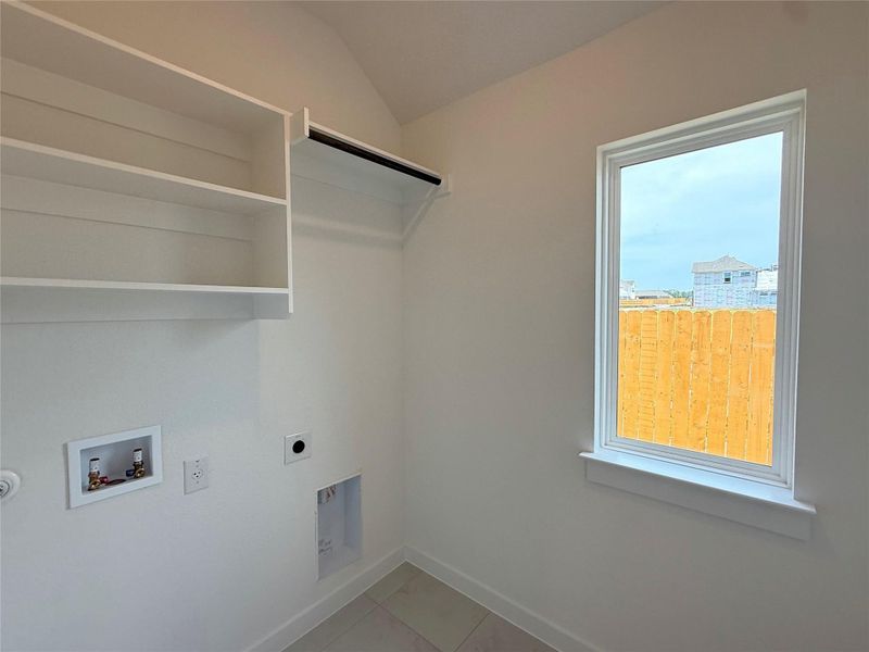 Washroom with hookup for an electric dryer and washer hookup Washroom with hookup for an electric dryer and washer hookup