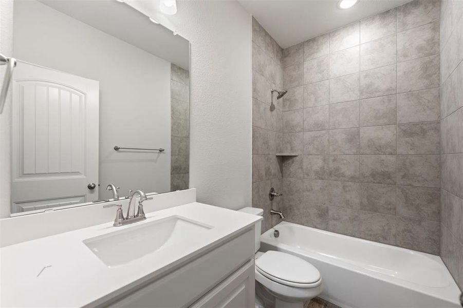 Full bath with vanity, shower / tub combination, and recessed lighting