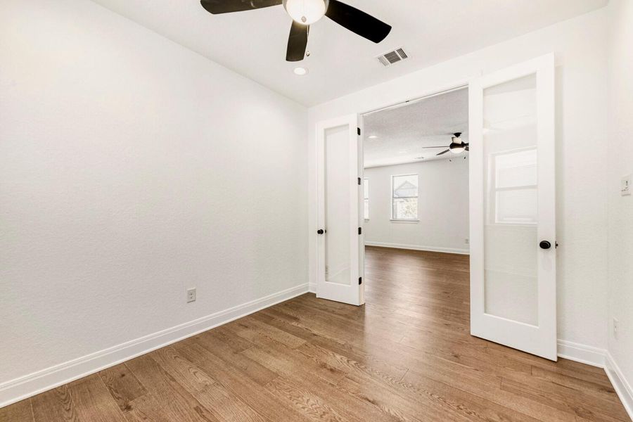 Spare room featuring ceiling fan, light wood-style flooring, and recessed lighting Spare room featuring ceiling fan, light wood-style flooring, and recessed lighting
