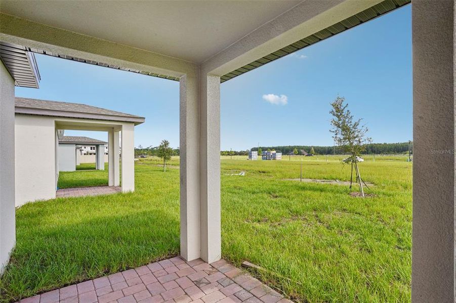 Exterior details and patio area of a home in The Meadow at Crossprairie, St. Cloud (Image 4).