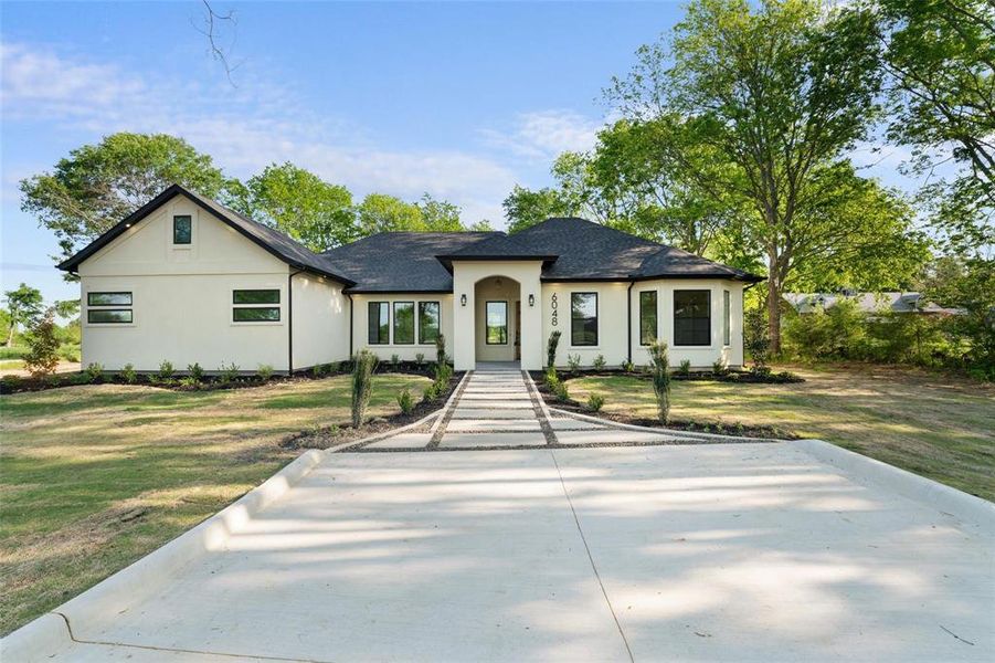 View of front of house featuring a front lawn, stucco siding, and a shingled roof View of front of house featuring a front lawn, stucco siding, and a shingled roof