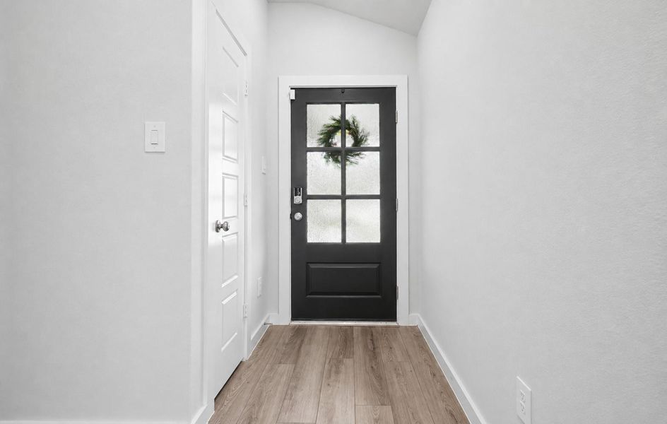 The attractive front door provides a nice touch of natural light in the entry way. The attractive front door provides a nice touch of natural light in the entry way.