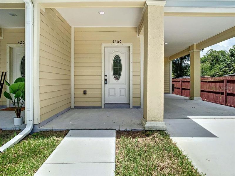Front exterior of a new home in , Tampa, FL, highlighting curb appeal (Image 24).