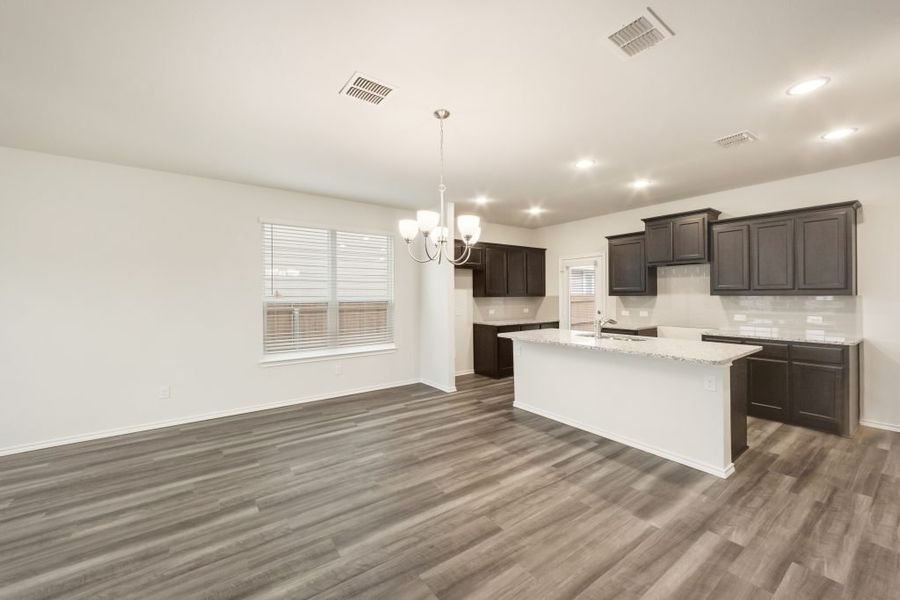 Representative exterior photo of a completed home built from the Harwood by Impression Homes in Heartland, Heartland, TX (Image 9).
