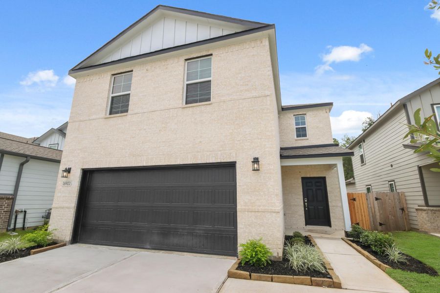 Front exterior of a new home in Lonestar Collection at Granger Pines, Conroe, TX, highlighting curb appeal (Image 16). Front exterior of a new home in Lonestar Collection at Granger Pines, Conroe, TX, highlighting curb appeal (Image 16).